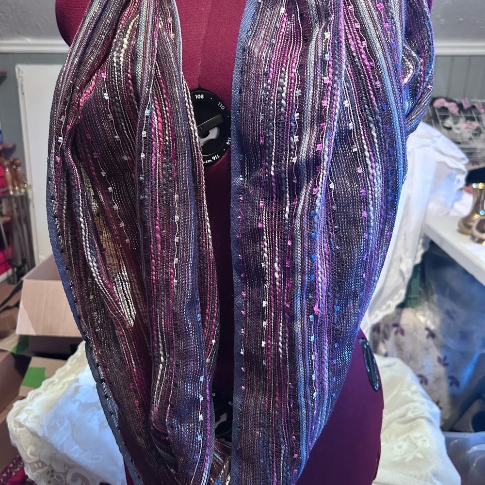 A contemporary woven multicolour infinity scarf with metallic accents.- like new